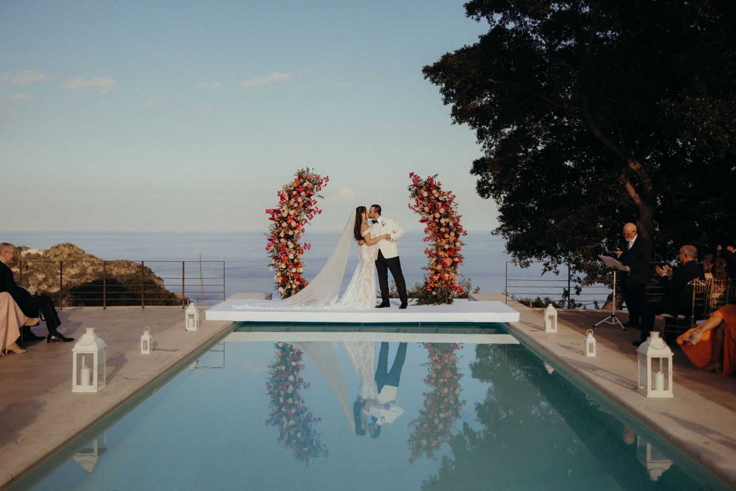 Romantic wedding reception in an elegant Sicilian courtyard at dusk